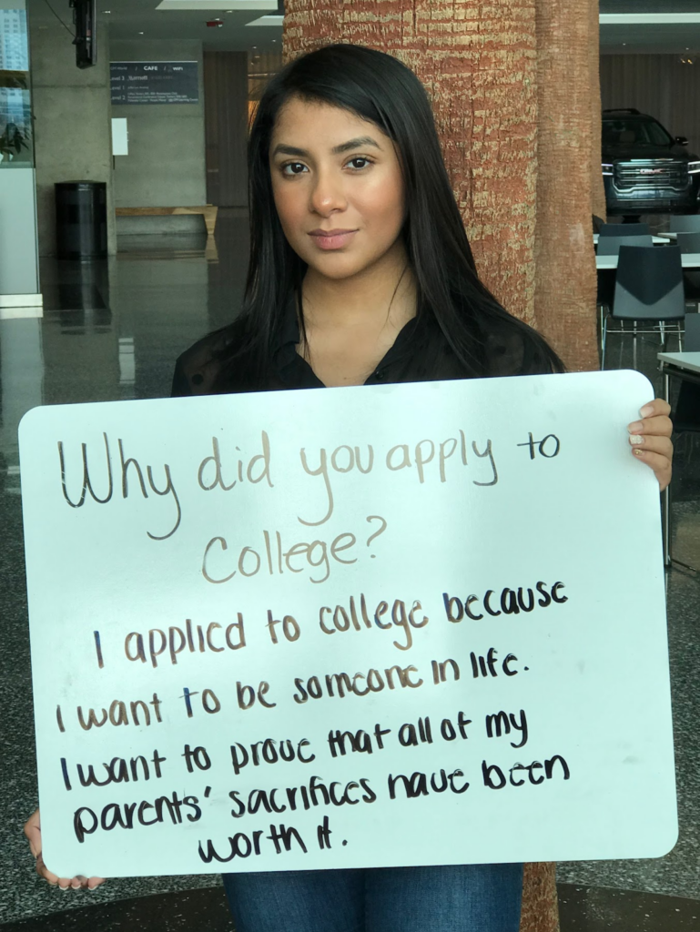 MIHC Student holding a sign