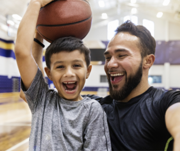 Parent and child laughing.